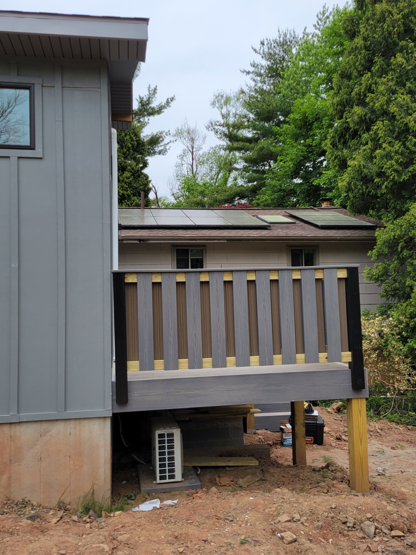 Composite deck with gray railings and black posts